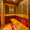 OBNOVA 4-5 PERSON SAUNA showcasing the red cedar interior large l shaped dual tier seating and red light tubes