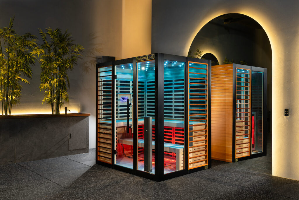Obnova infrared luxury sauna showcaing blue chromotherapy lighting and stunning red cedar interior