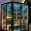 VATRA 3-4 PERSON SAUNA show casing the sleek titanium frame, red cedar and sky blue chromotherapy lights