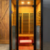 shop_saunas front view of Mirna 2-person infrared sauna with red cedar, black titanium frame and glass door