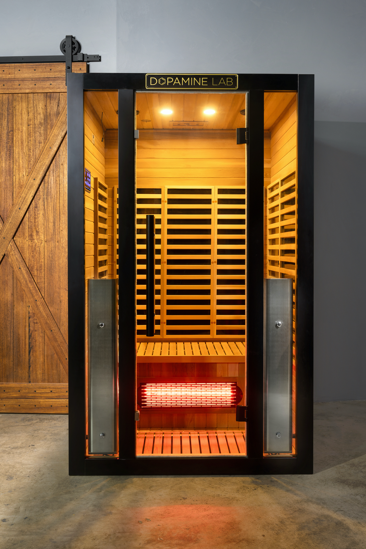 shop_saunas front view of Mirna 2-person infrared sauna with red cedar, black titanium frame and glass door
